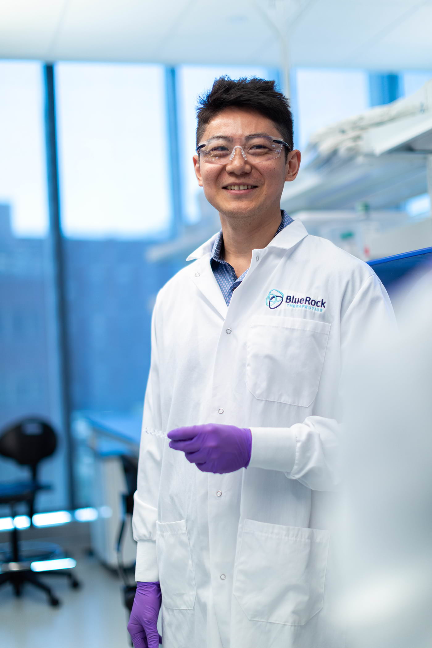 A BlueRock Therapeutics scientists smiling in a lab