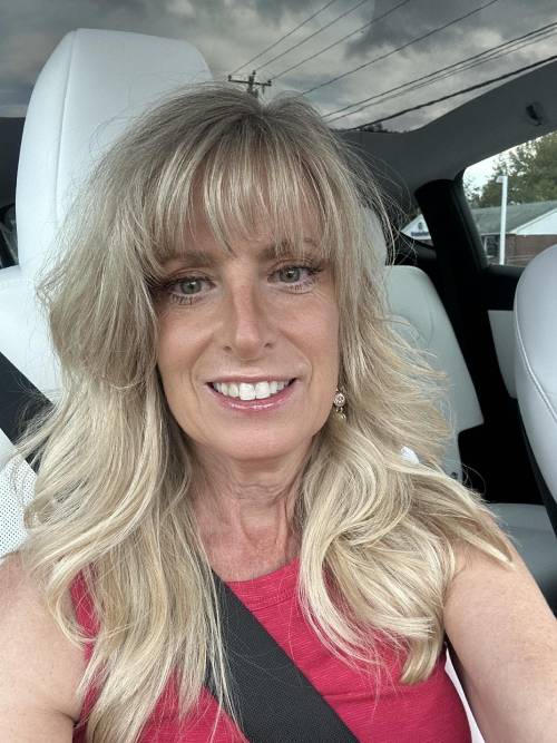 Jane, taking a selfie in her car.